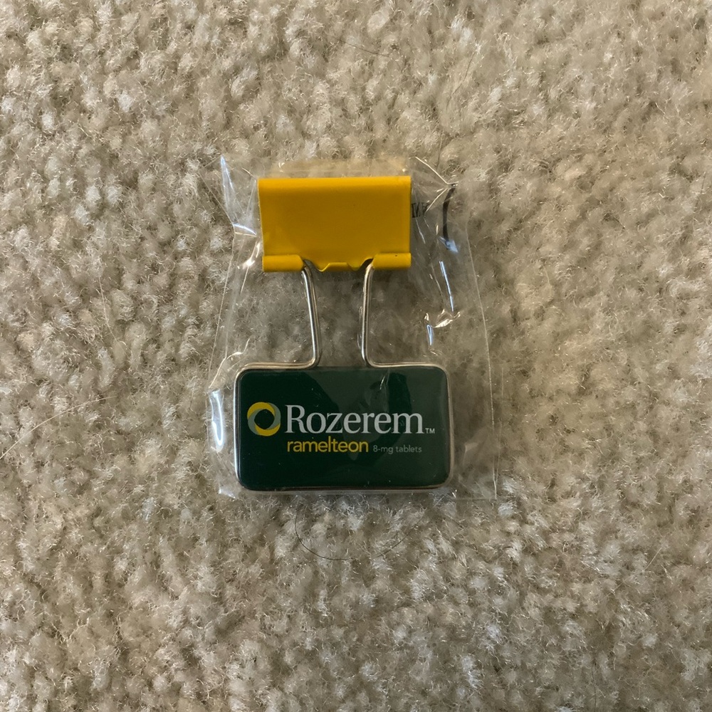 VINTAGE ROZEREM GREEN/YELLOW BINDER CLIP PHARMACEUTICAL DRUG REP LOGO NEW